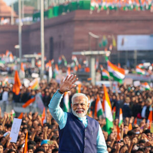Image is showing Prime Minister Narendra Modi waving to his citizens 
